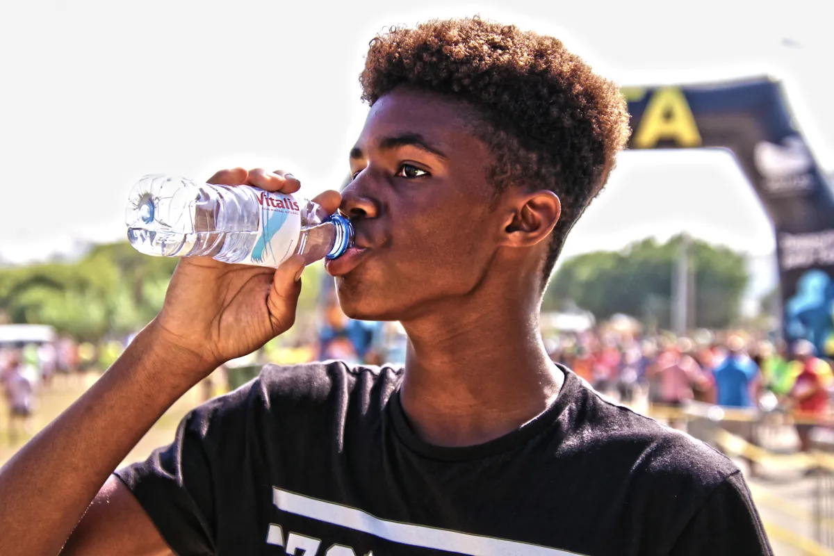 A person drinking water after activity