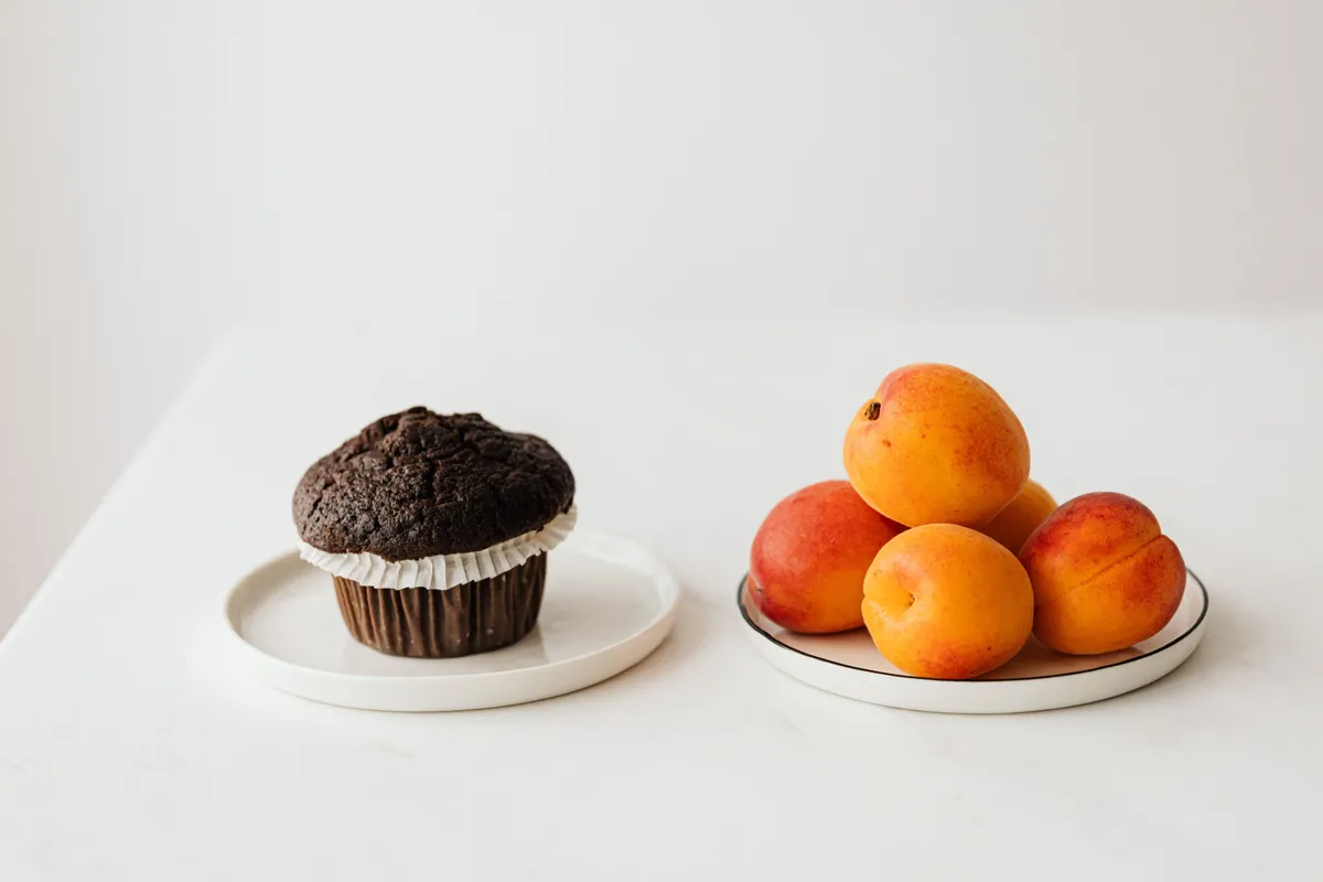 Whole fruit beside sugary processed foods, showing the real difference